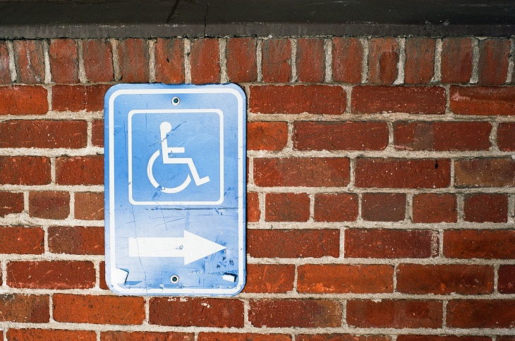 Dr. Handicap - parking sign brick wall