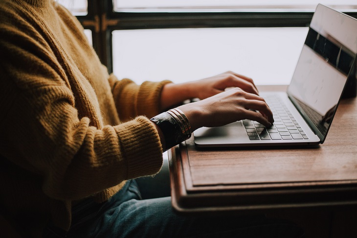 Dr Handicap - woman typing at computer