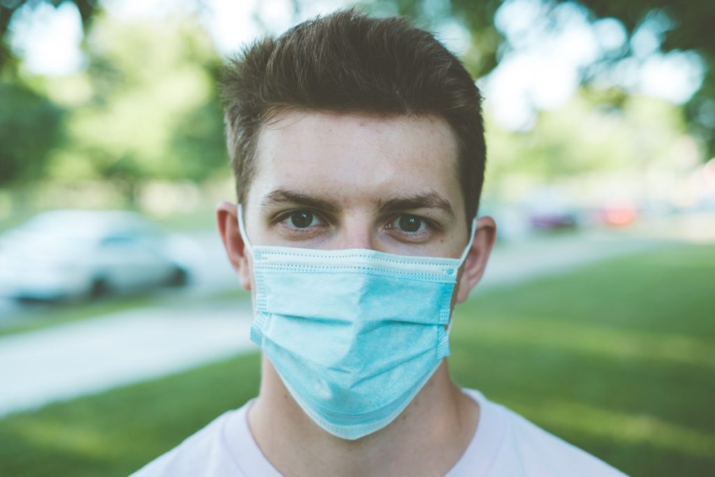 person with covid-19 wearing mask