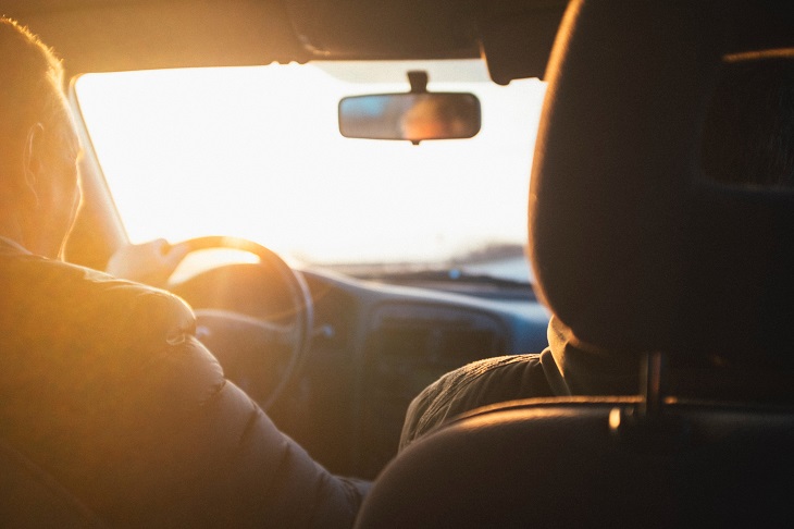 two people traveling in car