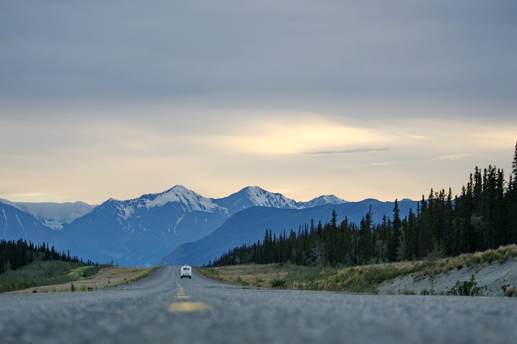 car driving on road in alaska