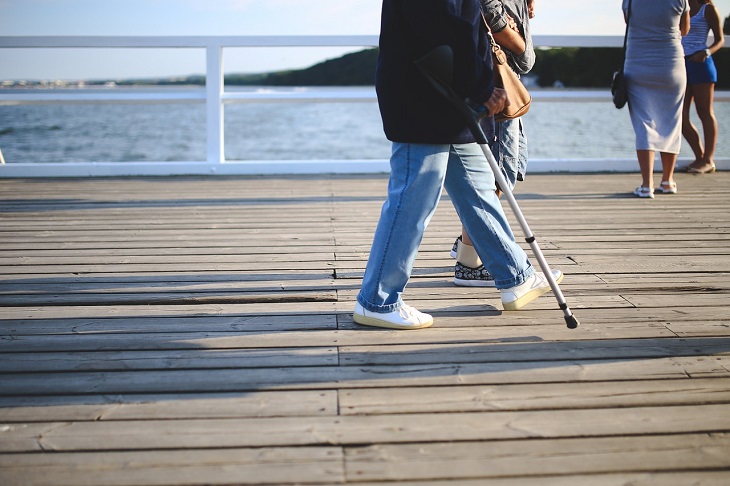 person using crutches to walk