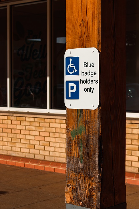 disabled parking sign on pole