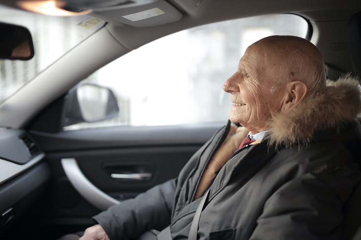 older man in car